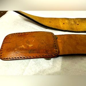 Vintage gorgeous ranch scene leather belt with wrapped leather buckle.